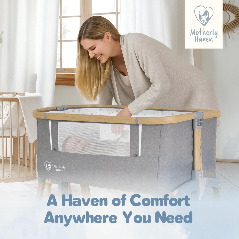 Motherly Haven light-grey bassinet with easy-clean mattress for tidy naps.