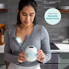 Motif Medical Aura Glow nightlight illuminates a nighttime pumping session.