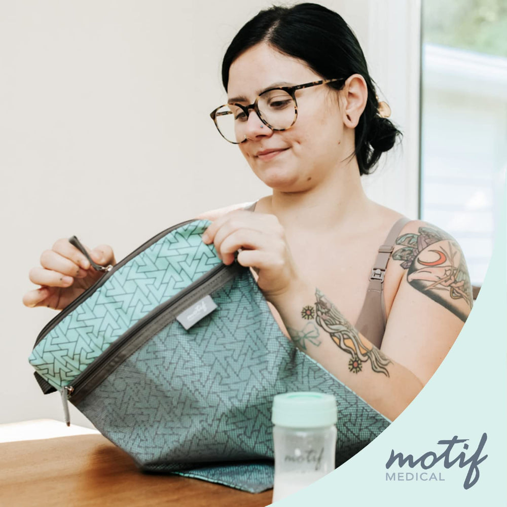 Motif Medical baby wet dry bag aqua front mesh pocket provides quick access to clean clothes.