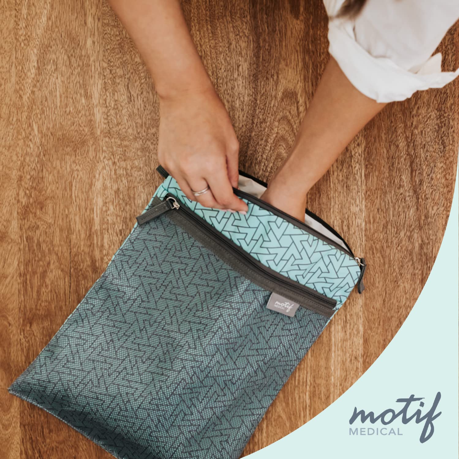 Motif Medical wet dry bag aqua stroller strap attaches to your pushchair for hands-free use.