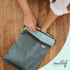 Motif Medical wet dry bag aqua stroller strap attaches to your pushchair for hands-free use.