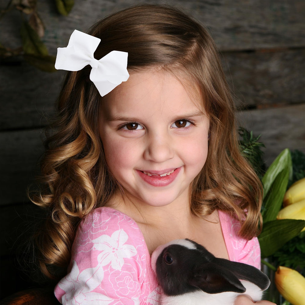 Motique bow worn in hair adds cheerful color to everyday outfits.