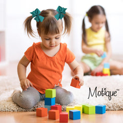 Motique dark turquoise bow with an alligator clip keeps hair secure during activities.