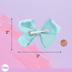 Motique pale blue bow clip worn in hair for daily wear