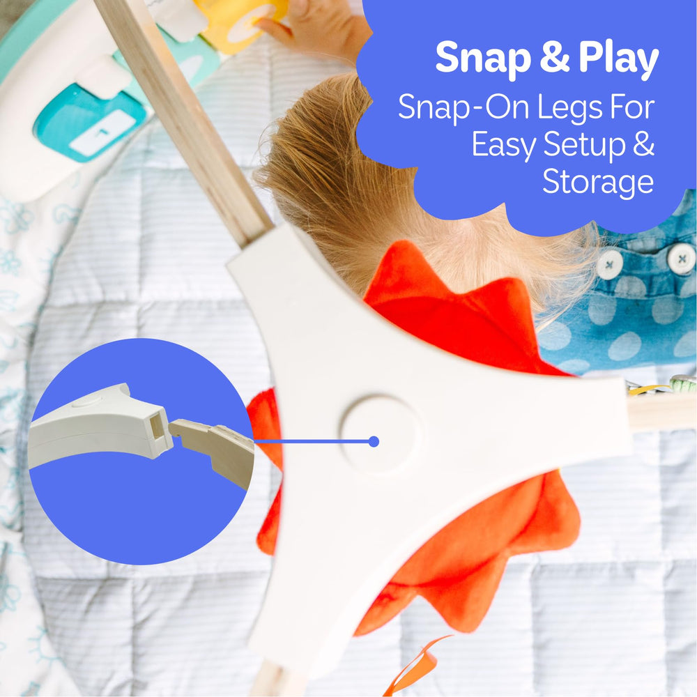 Move2Play baby using gym to explore textures, sounds, and movement.