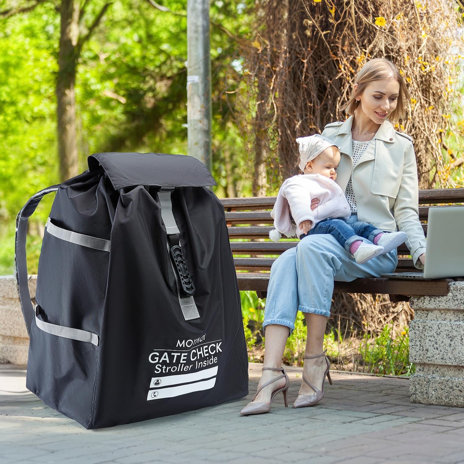 MOYAQI stroller travel bag shows adjustable shoulder straps for hands-free carrying.