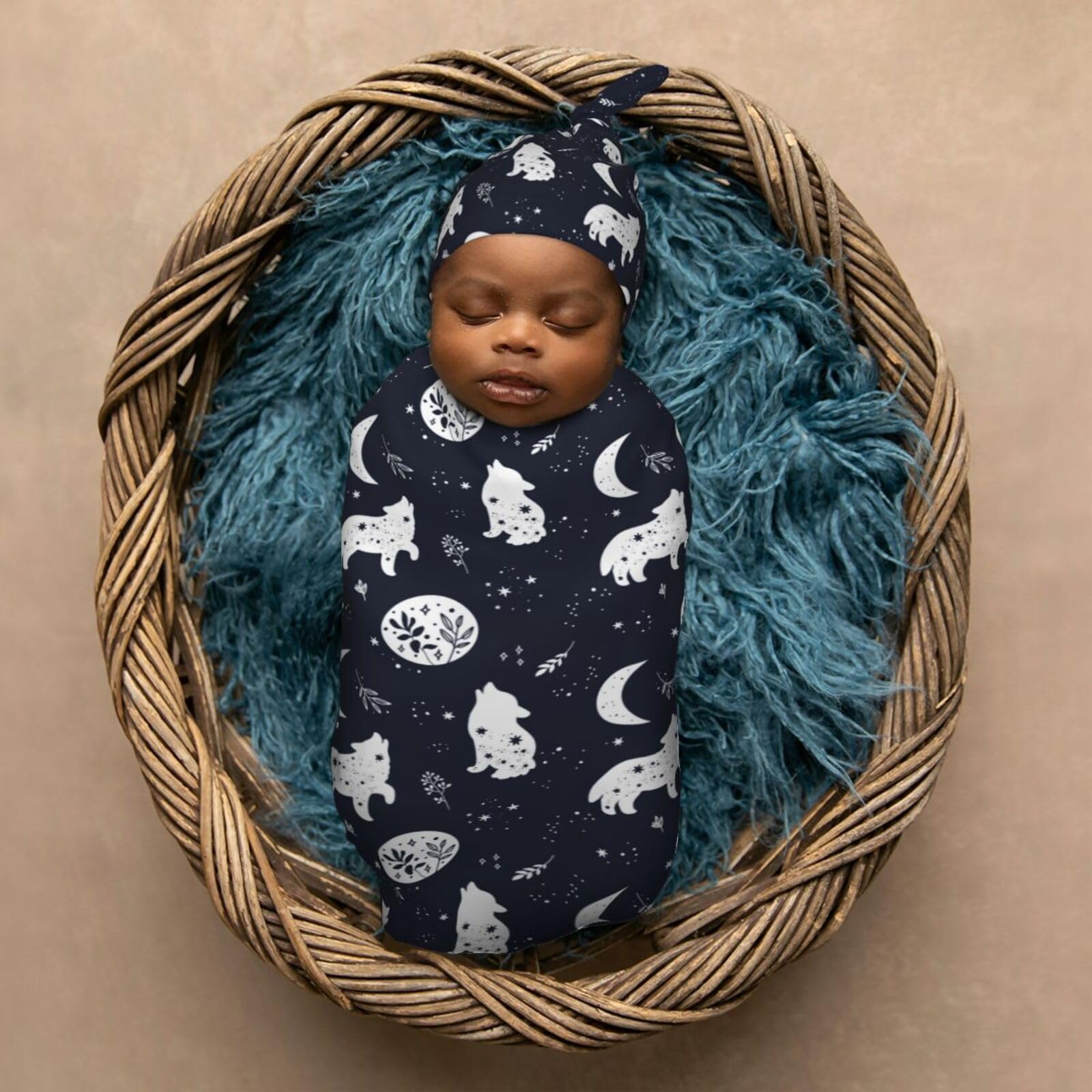 Muishi Boho Wolf newborn wardrobe setup with blanket and hat for easy outfit changes.