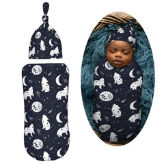 Muishi Boho Wolf swaddle wrapped baby demonstrates cocoon-like security and cozy warmth.