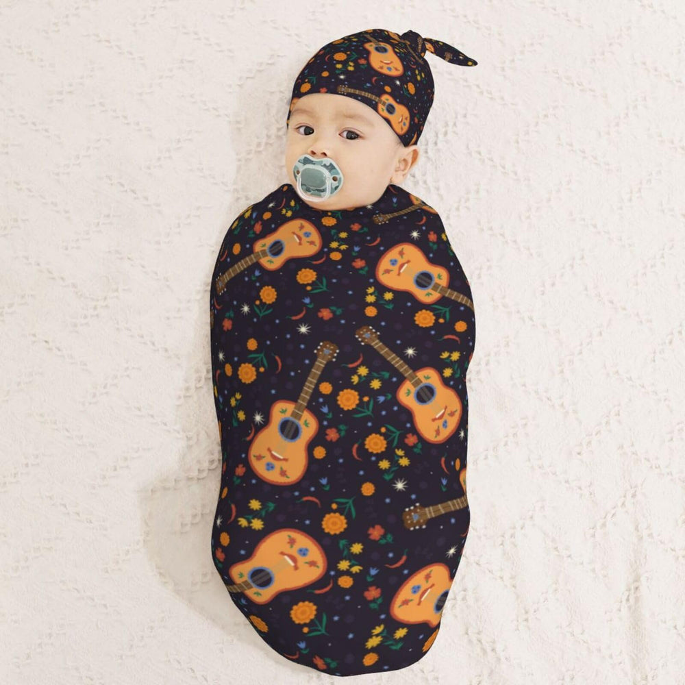 Muishi Guitar with Moon swaddle wrapped in blanket demonstrating cocoon security