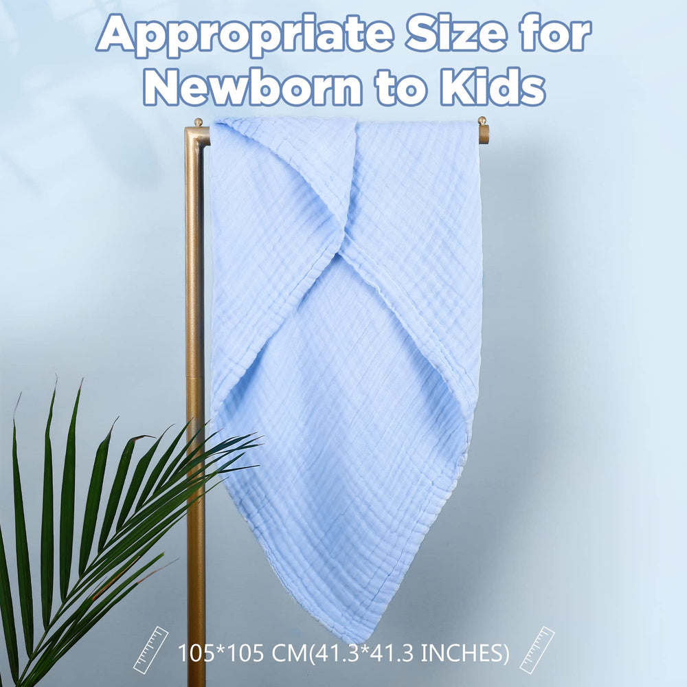 MUKIN baby towels wrapped around a tiny newborn after bath for cozy warmth