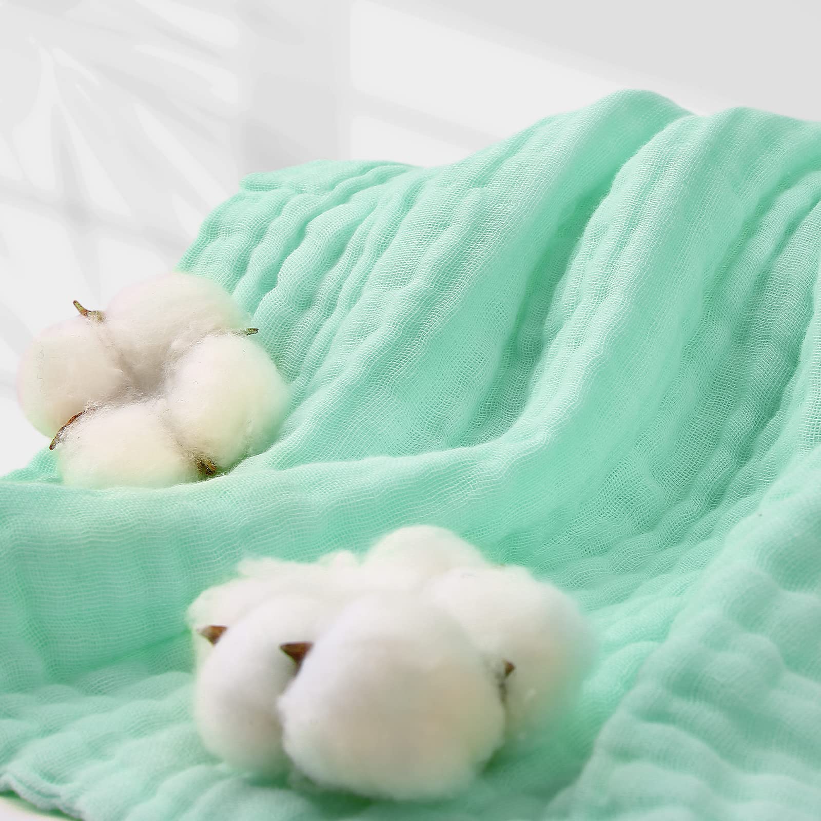 MUKIN baby towels doubling as a nursing cover for privacy.