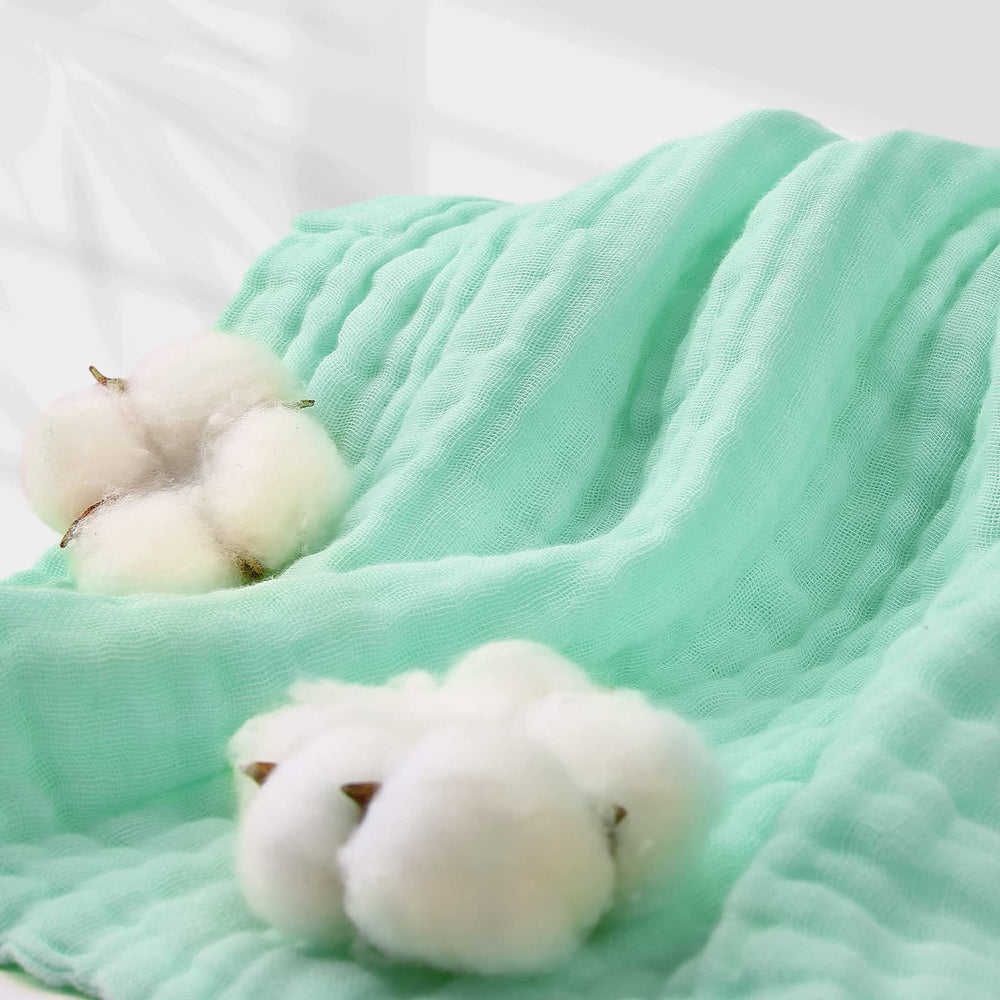 MUKIN baby towels doubling as a nursing cover for privacy.