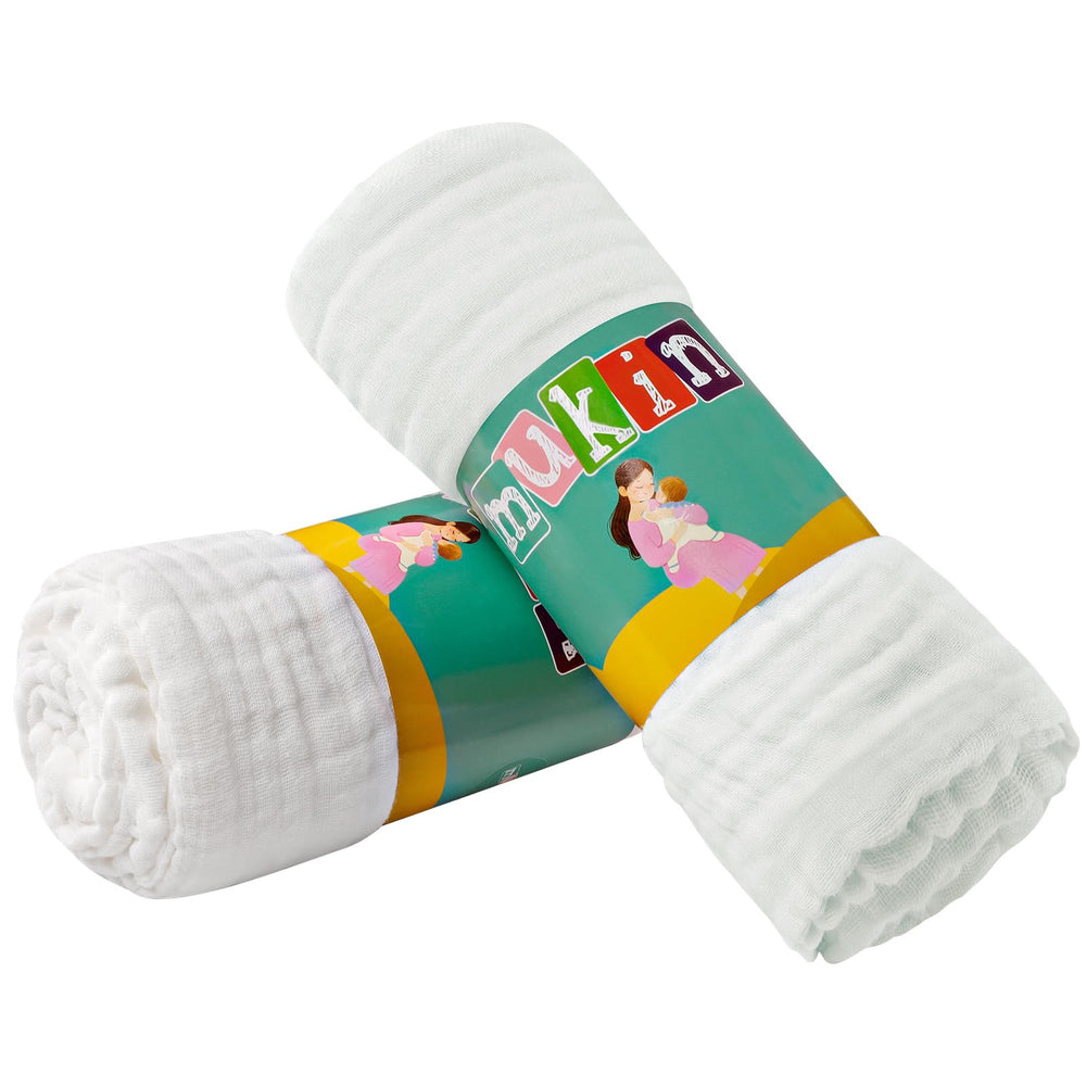 MUKIN baby towels wrapped around a baby for warmth and comfort