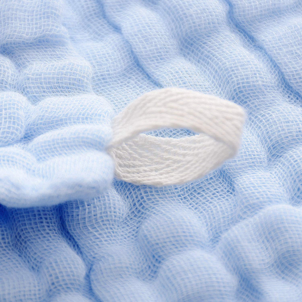 MUKIN six-layer cotton cloths offer absorbent comfort during bath time.