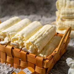 MUKIN washcloths stacked to show six-layer thickness for gentle cleaning.