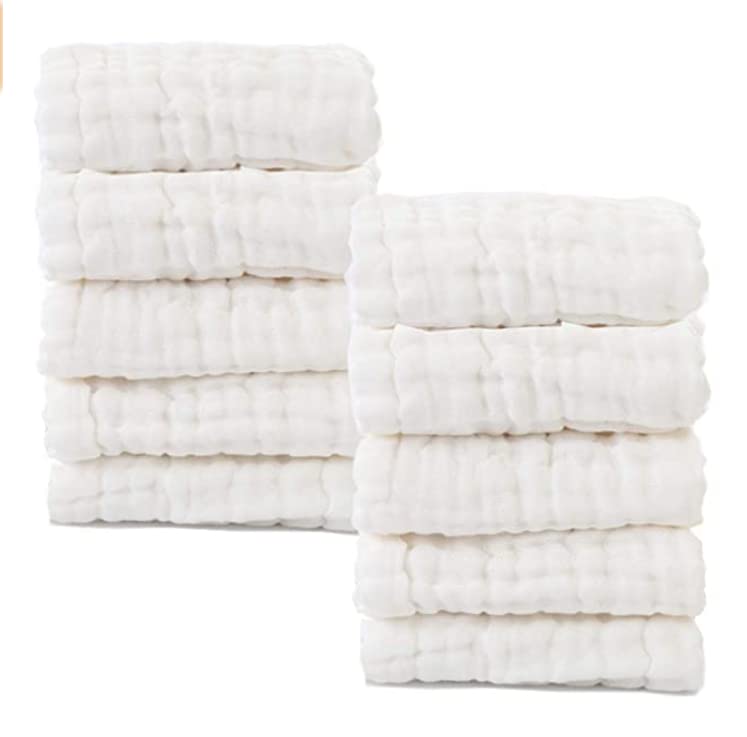 MUKIN pure white washcloths for nursery coordination and clean aesthetic.