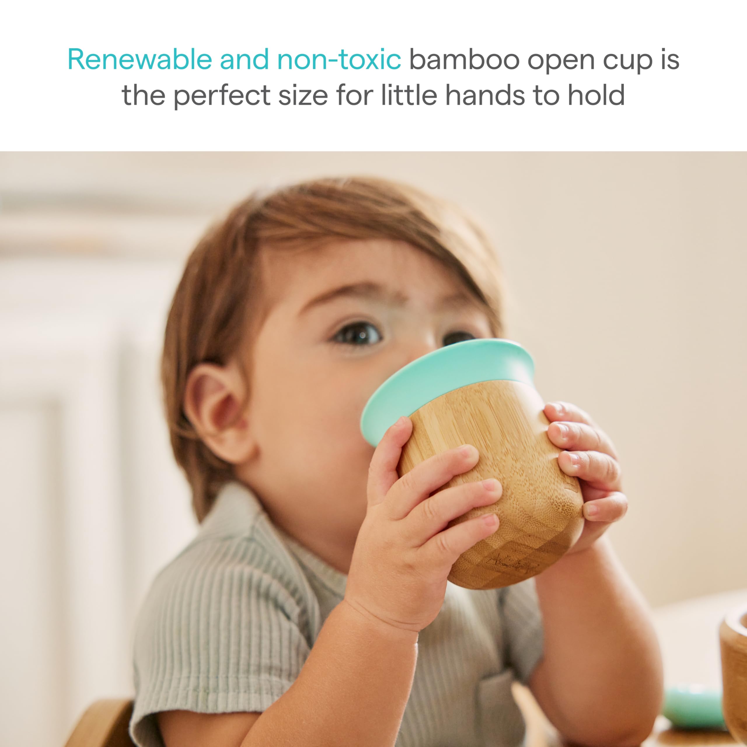Munchkin Bambou open cup held by toddler demonstrates grip-friendly design.