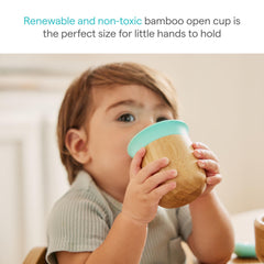 Munchkin Bambou open cup held by toddler demonstrates grip-friendly design.