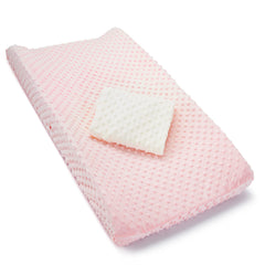 Munchkin changing pad cover in pink and white with textured design for comfy diaper changes.