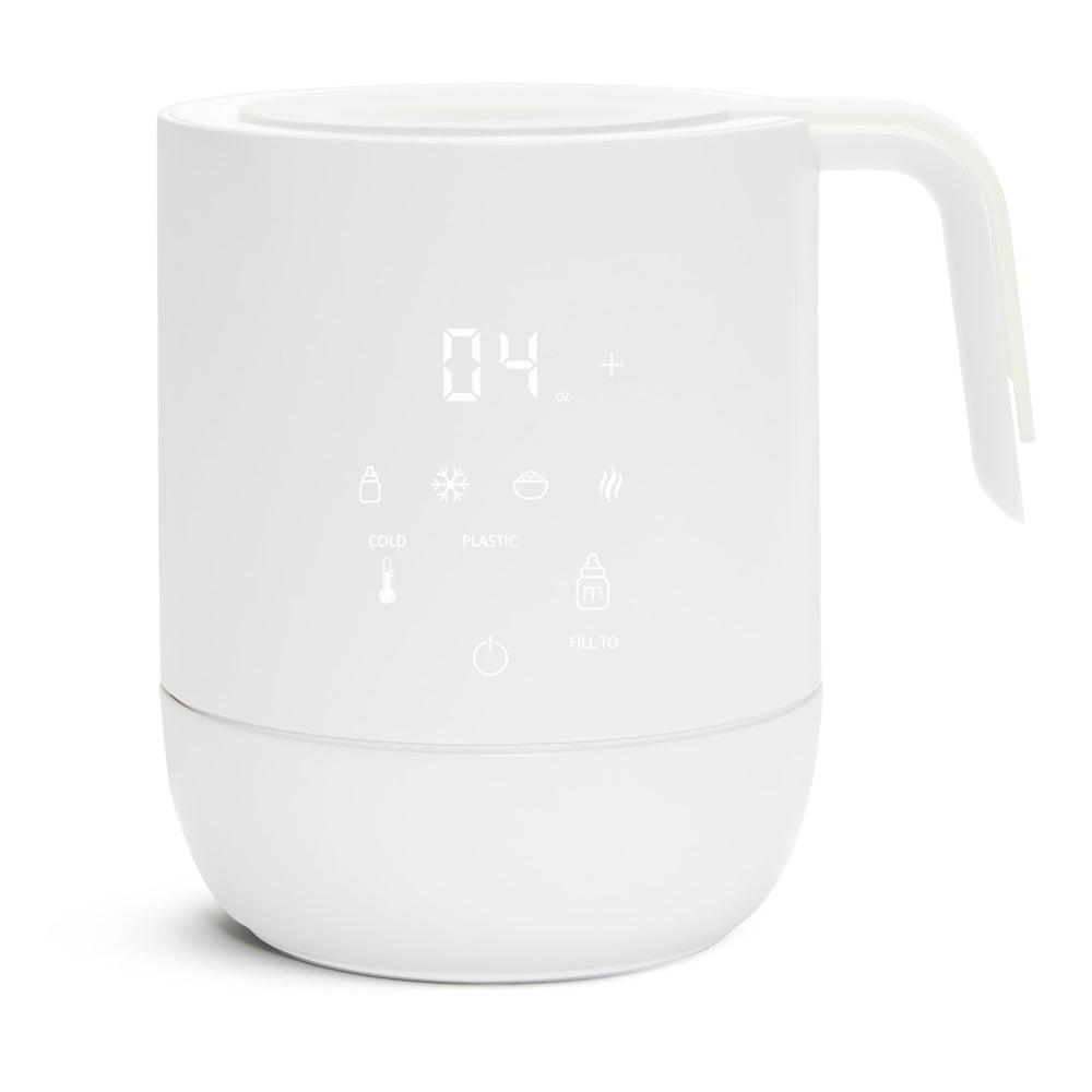 Munchkin Precision bottle warmer with digital display showing quick, uniform warming for breastmilk and formula.