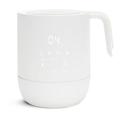 Munchkin Precision bottle warmer with digital display showing quick, uniform warming for breastmilk and formula.
