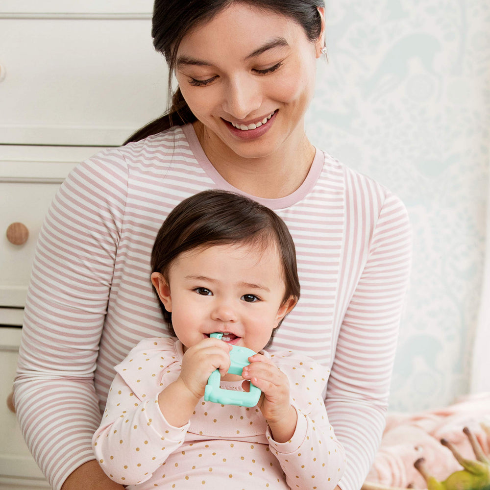 Munchkin Two-in-One Teether Spoon — dual function to ease early feeding and teething.