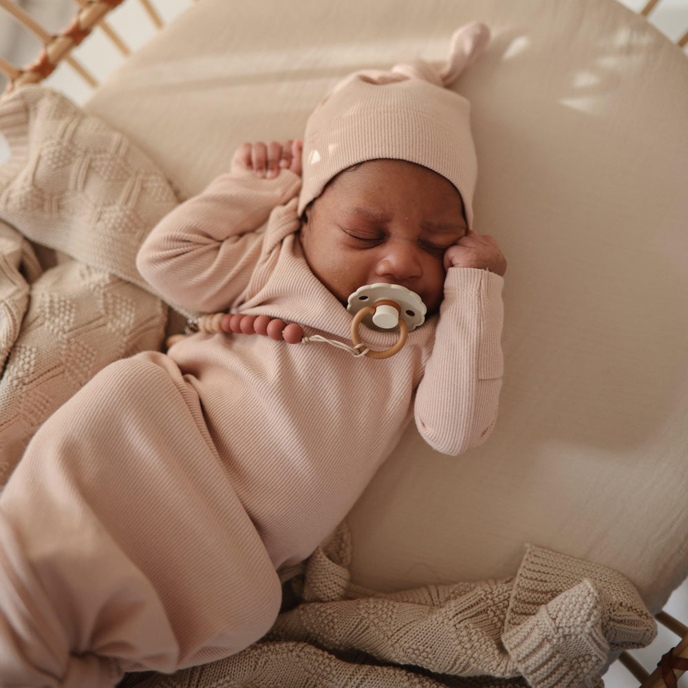 Mushie 100% cotton muslin crib sheet demonstrates durable softness in use