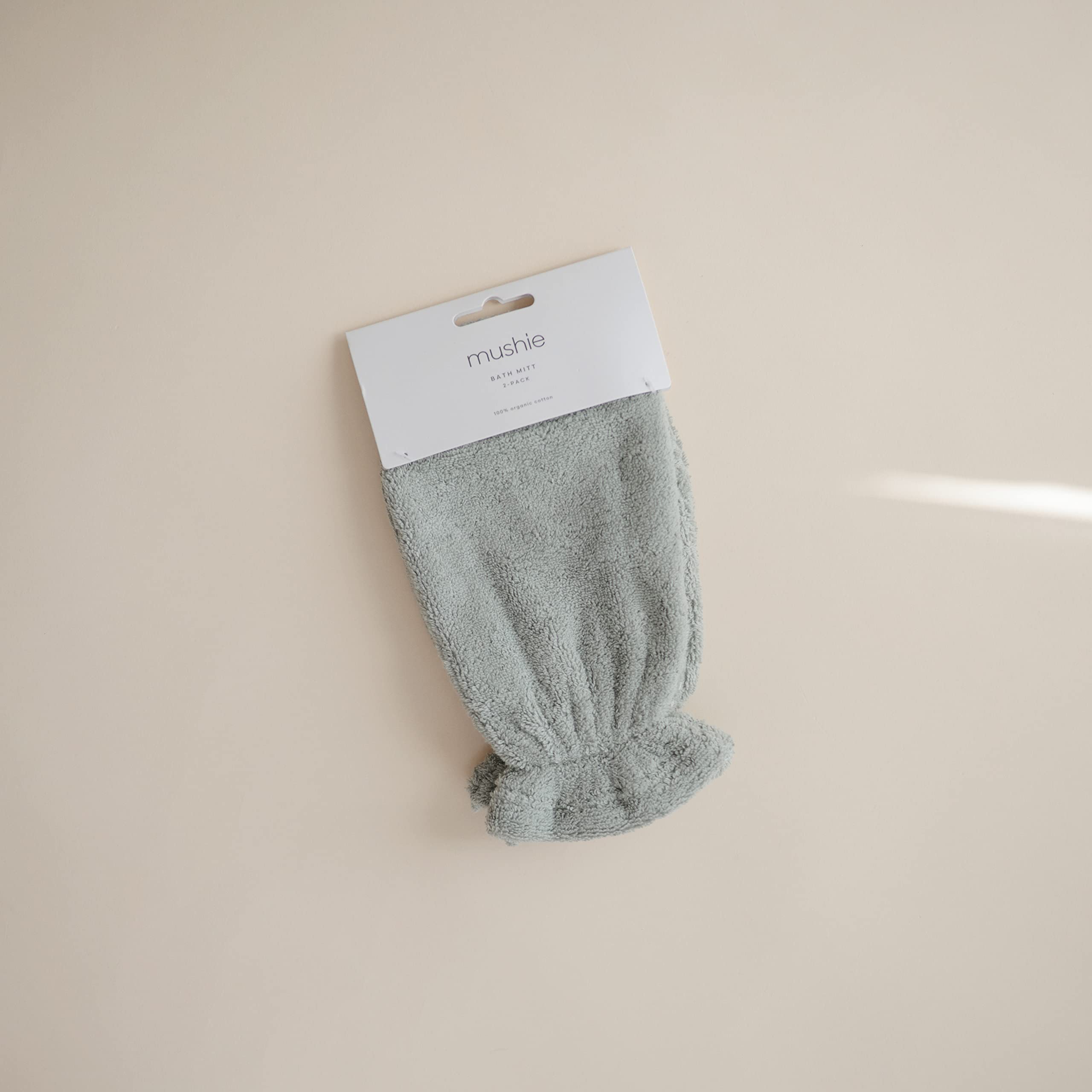Mushie baby bath mitt pack-2 moss design shown for easy bath time routine.