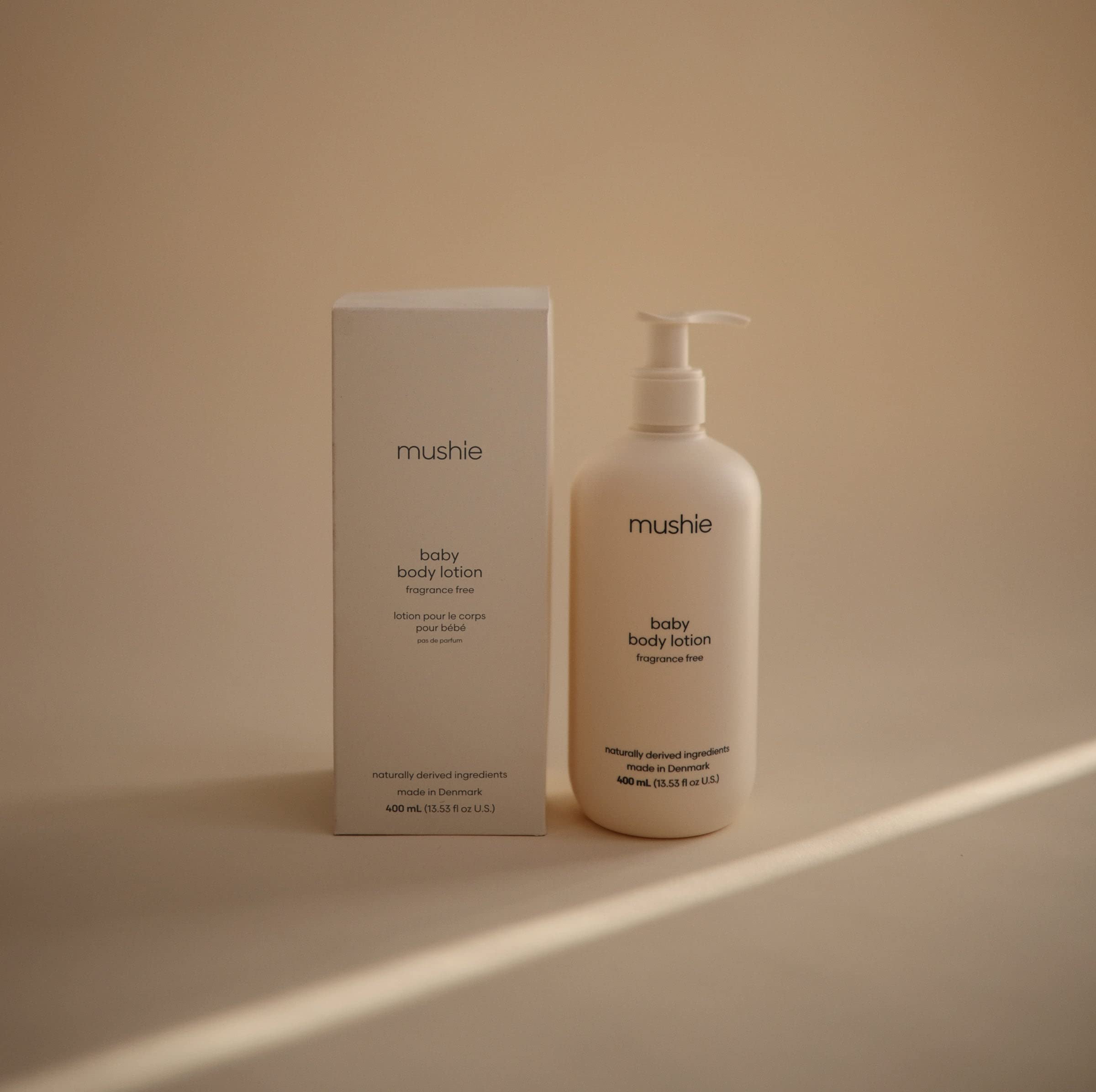 Mushie Baby Lotion closeup cream shows silky texture for gentle moisturization.