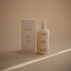 Mushie Baby Lotion closeup cream shows silky texture for gentle moisturization.
