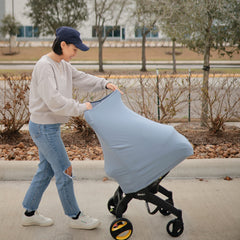 Mushie Car Seat Canopy Cover delivers stroller-coverage for daily outings.