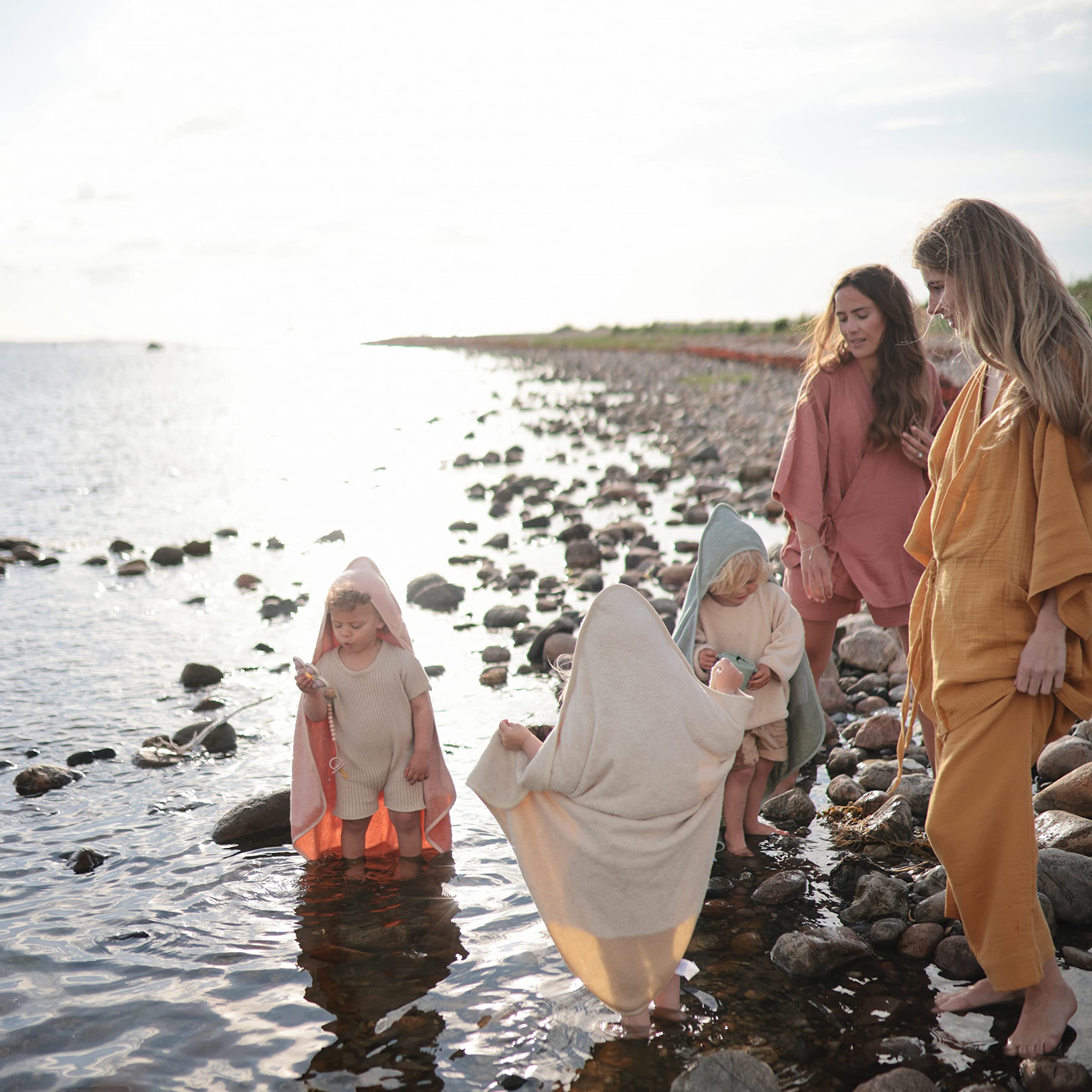 Mushie baby hooded towel pearl soft interior shown for quick, cozy post-bath drying.