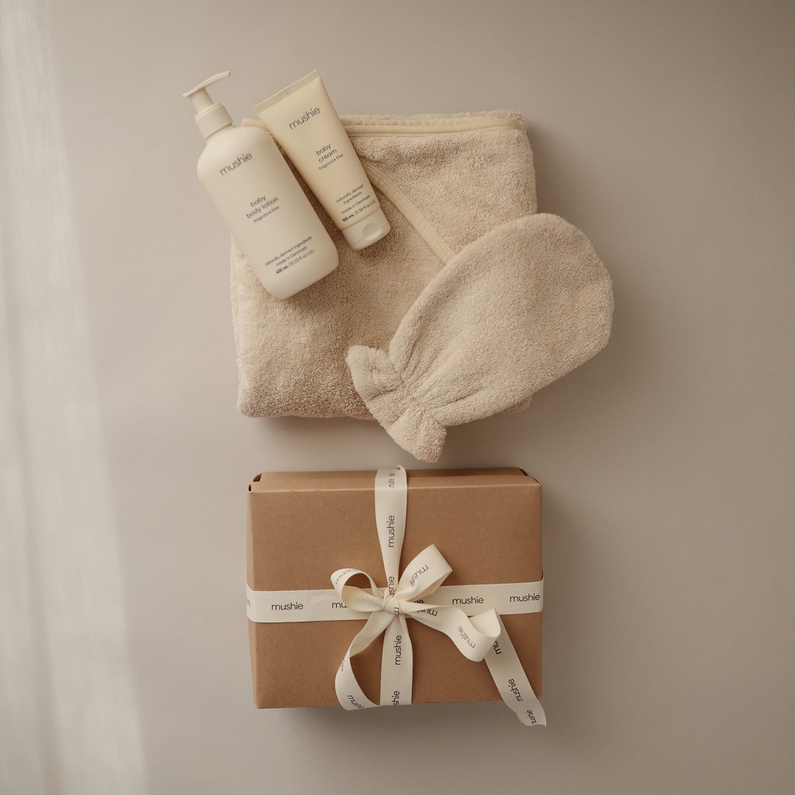 Mushie hooded towel pearl machine washable option showcased for easy care and lasting softness.