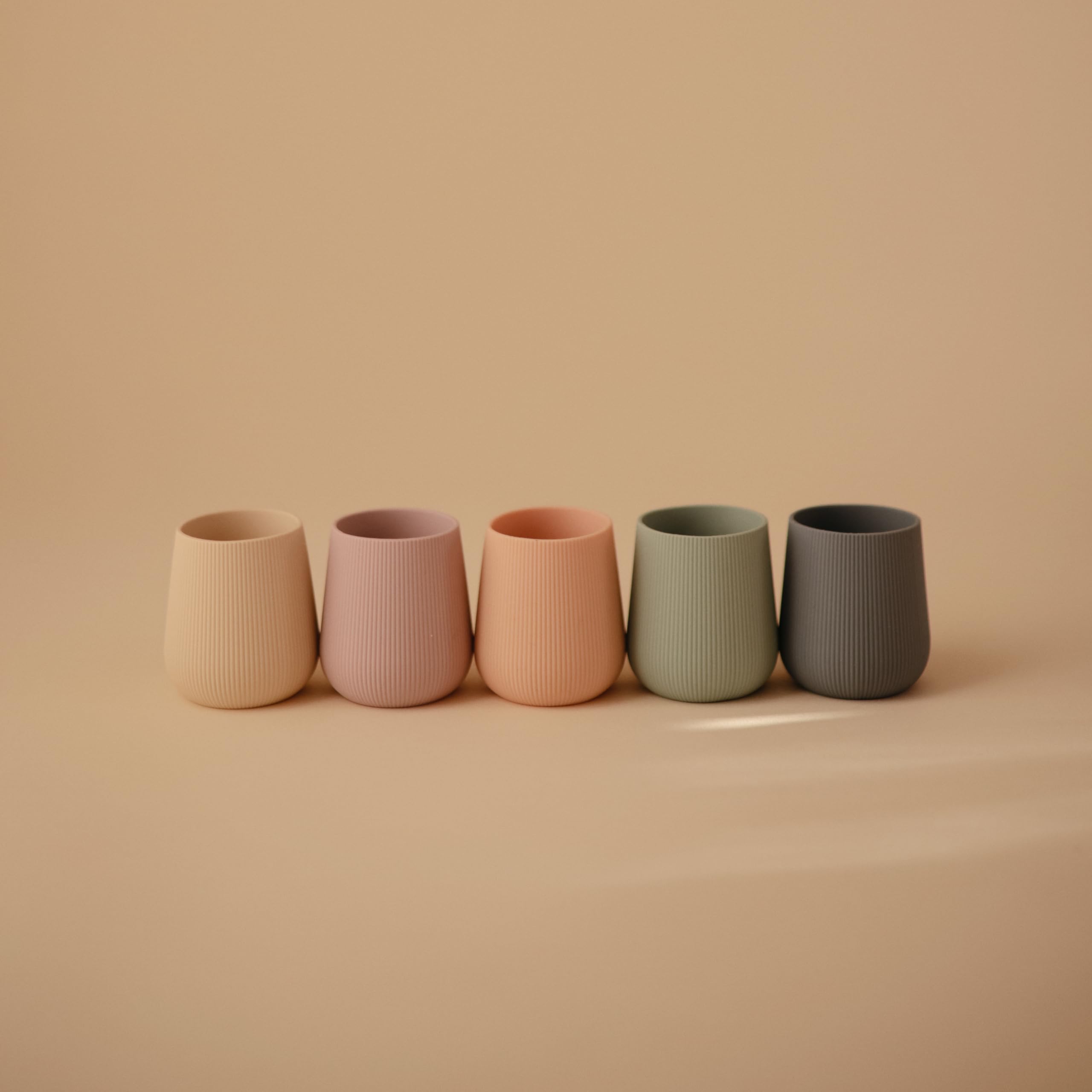Mushie silicone starter cup Tradewinds weighted base prevents tipping during early drinks