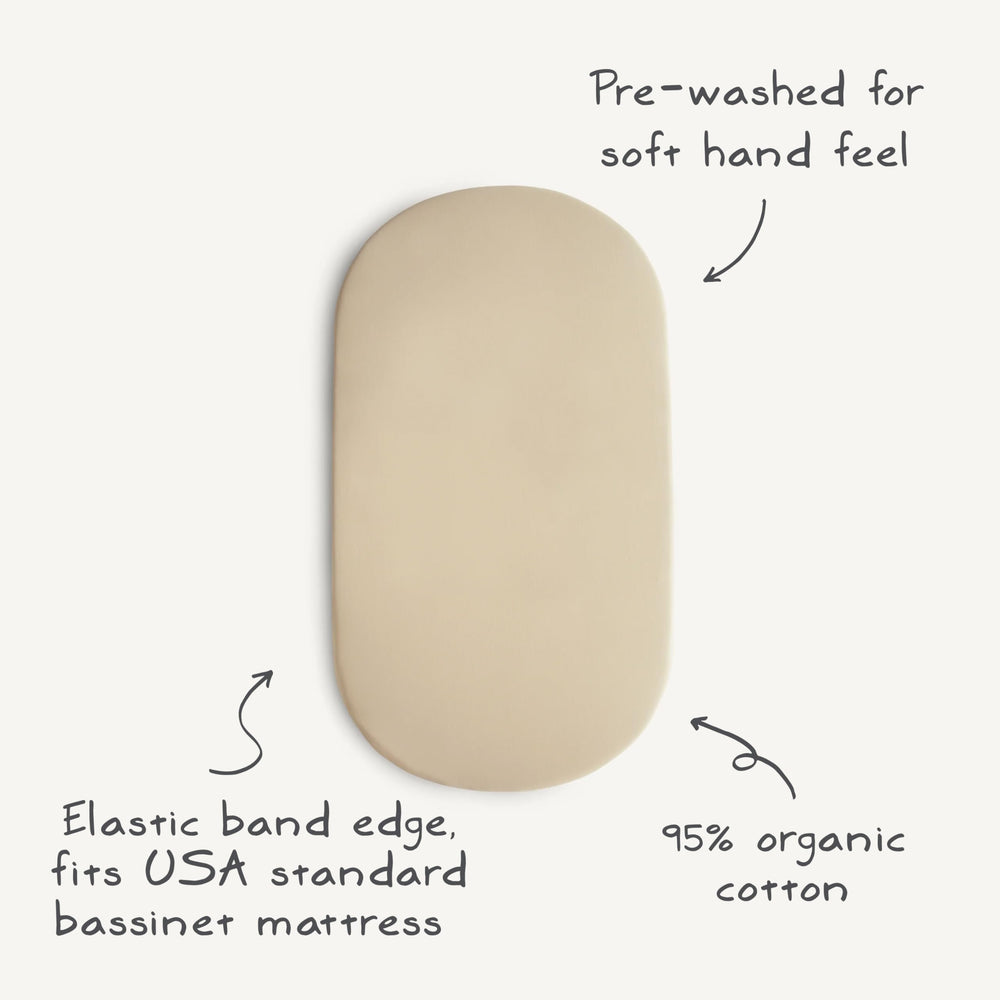 Mushie fitted 16x30 Rainbows sheet on mattress for snug, safe sleeping space.