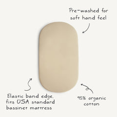 Mushie fitted 16x30 Rainbows sheet on mattress for snug, safe sleeping space.