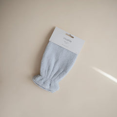 Mushie bath mitt soft absorbent fabric for comfy rinsing.