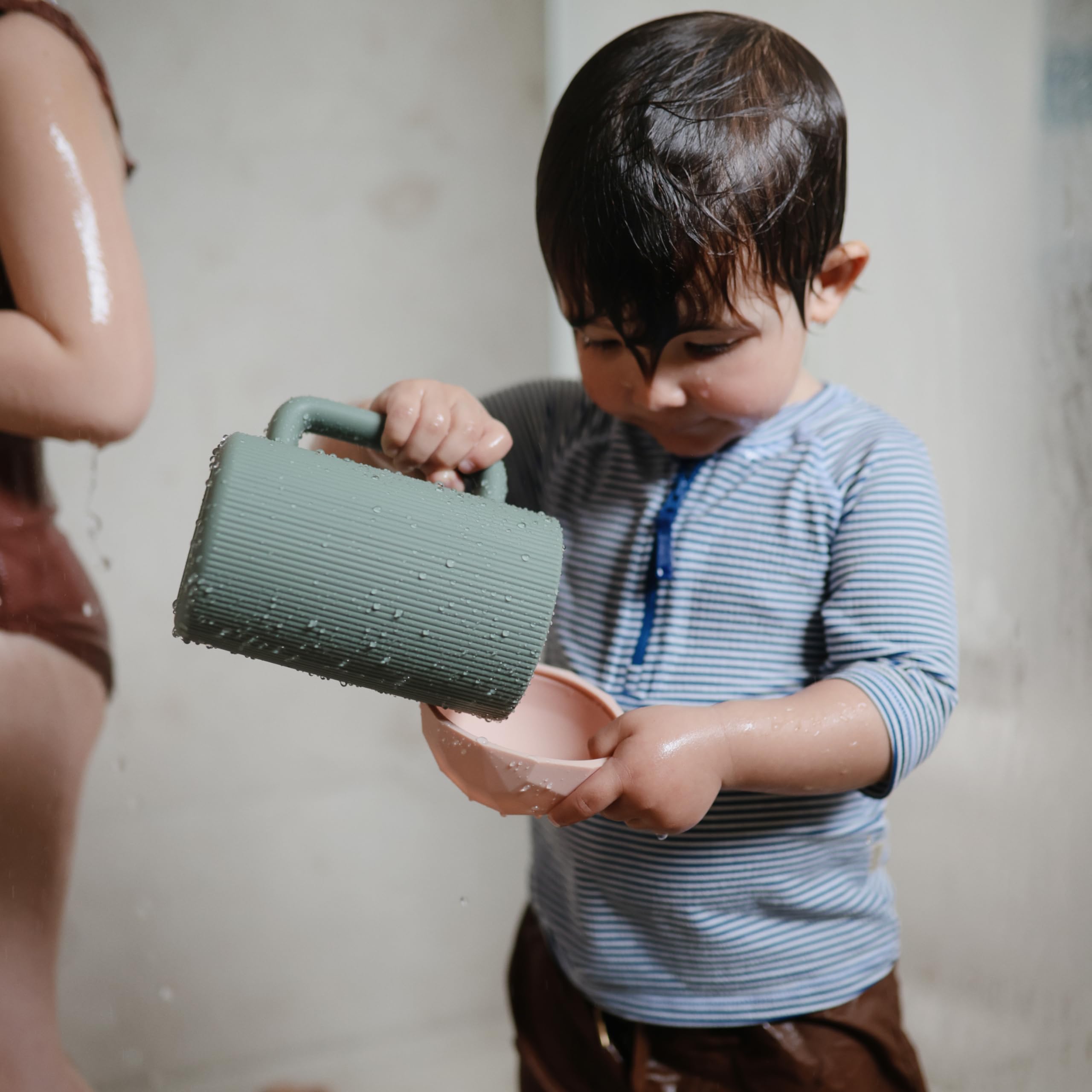 Mushie bath rinse cup in dried thyme color adds calming bath aesthetics.