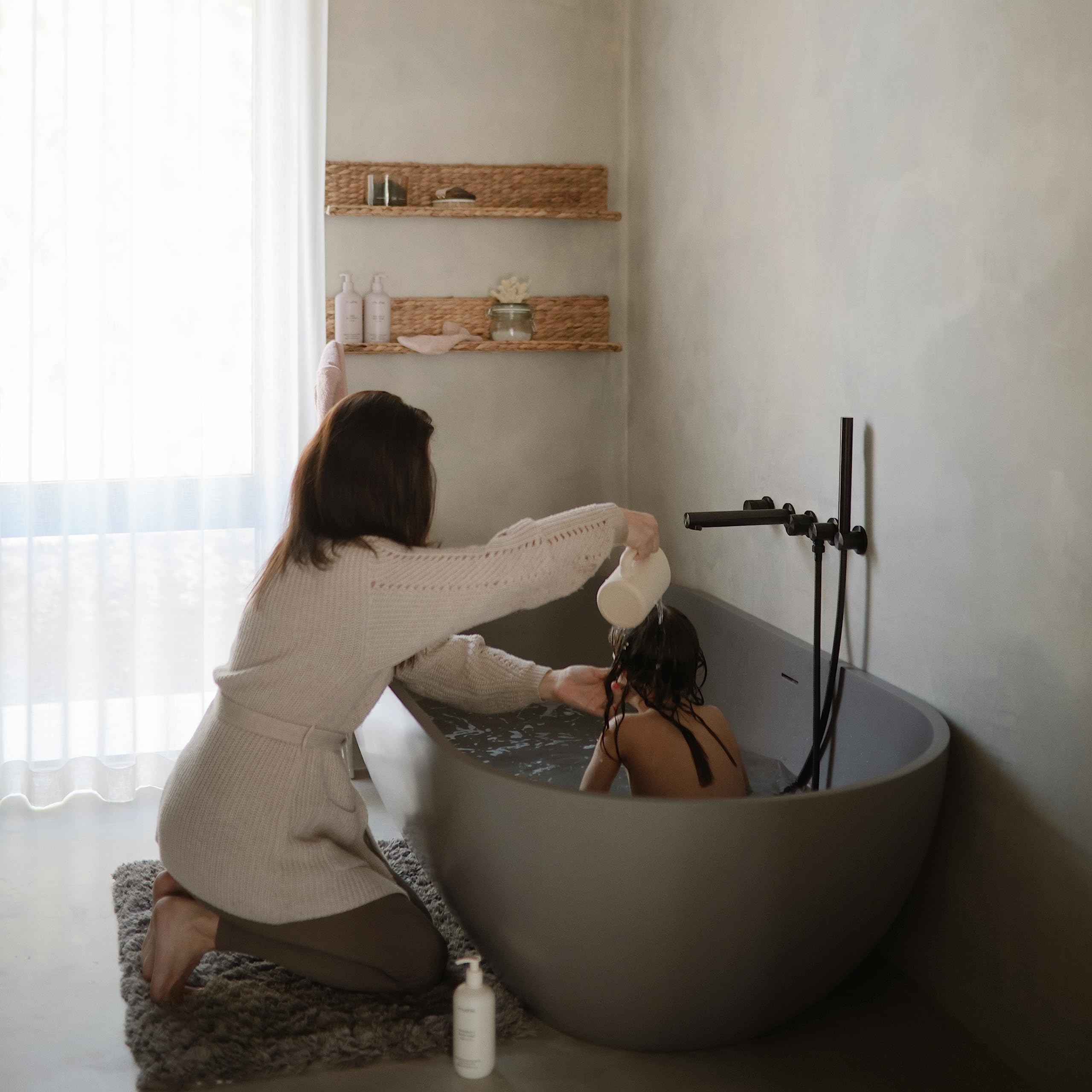 Mushie bath rinse cup ergonomic handle helps parents guide water