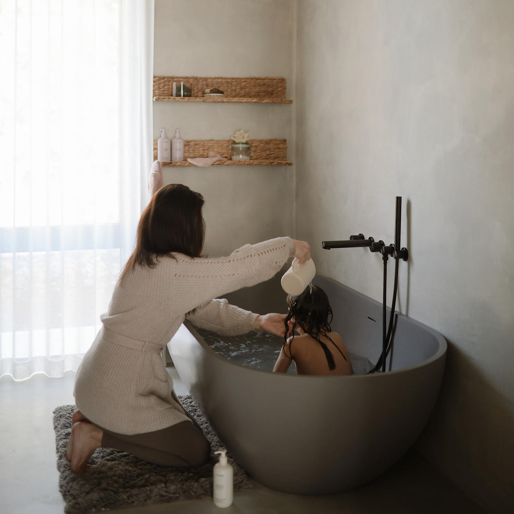 Mushie bath rinse cup ergonomic handle helps parents guide water