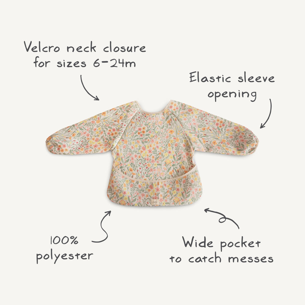 Mushie Bees long sleeve bib close-up reveals 100% polyester main fabric with cotton trim.