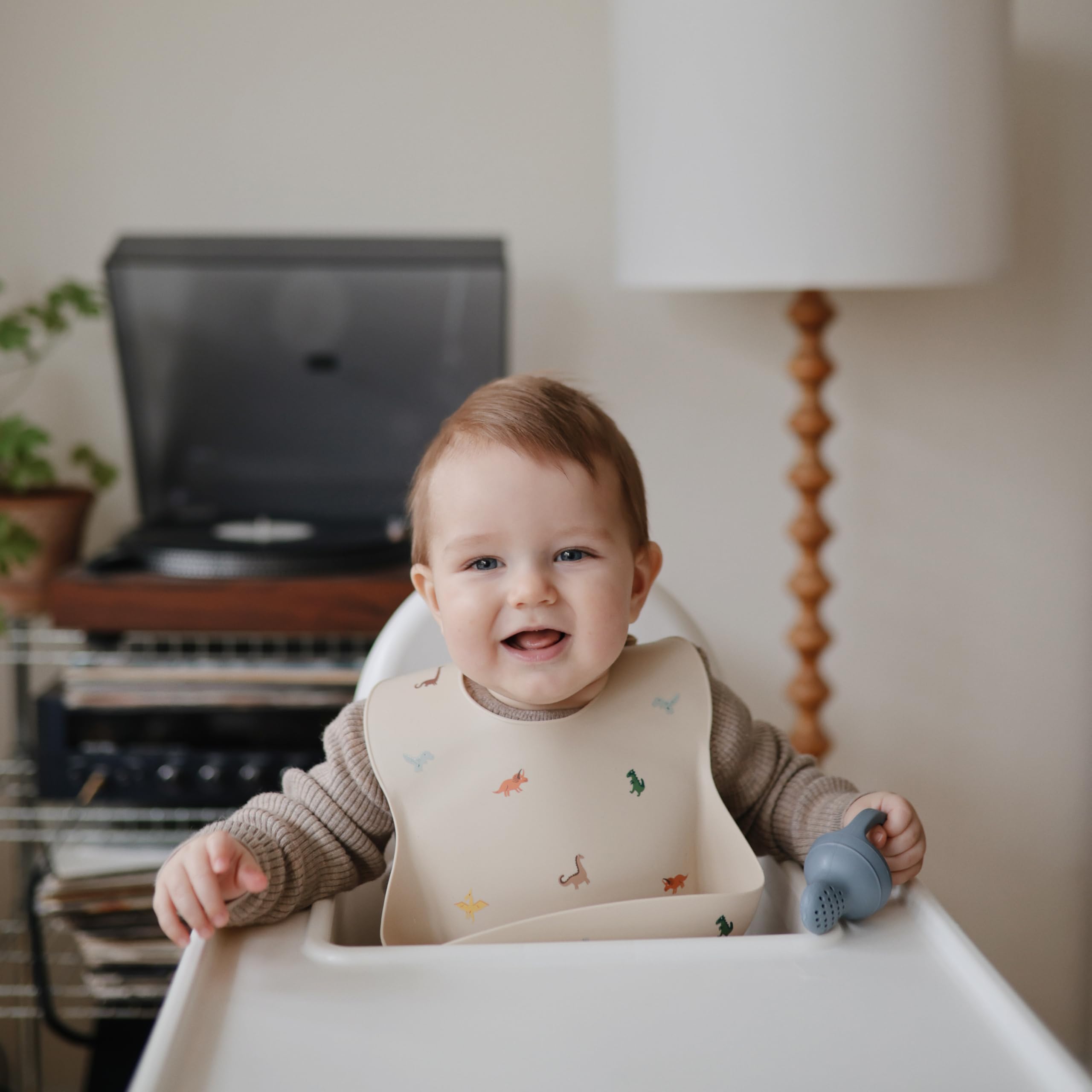 Mushie bib soft texture conveys gentle comfort against baby’s skin.