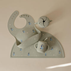 Mushie Bluey waterproof silicone bib surface resists stains during meals