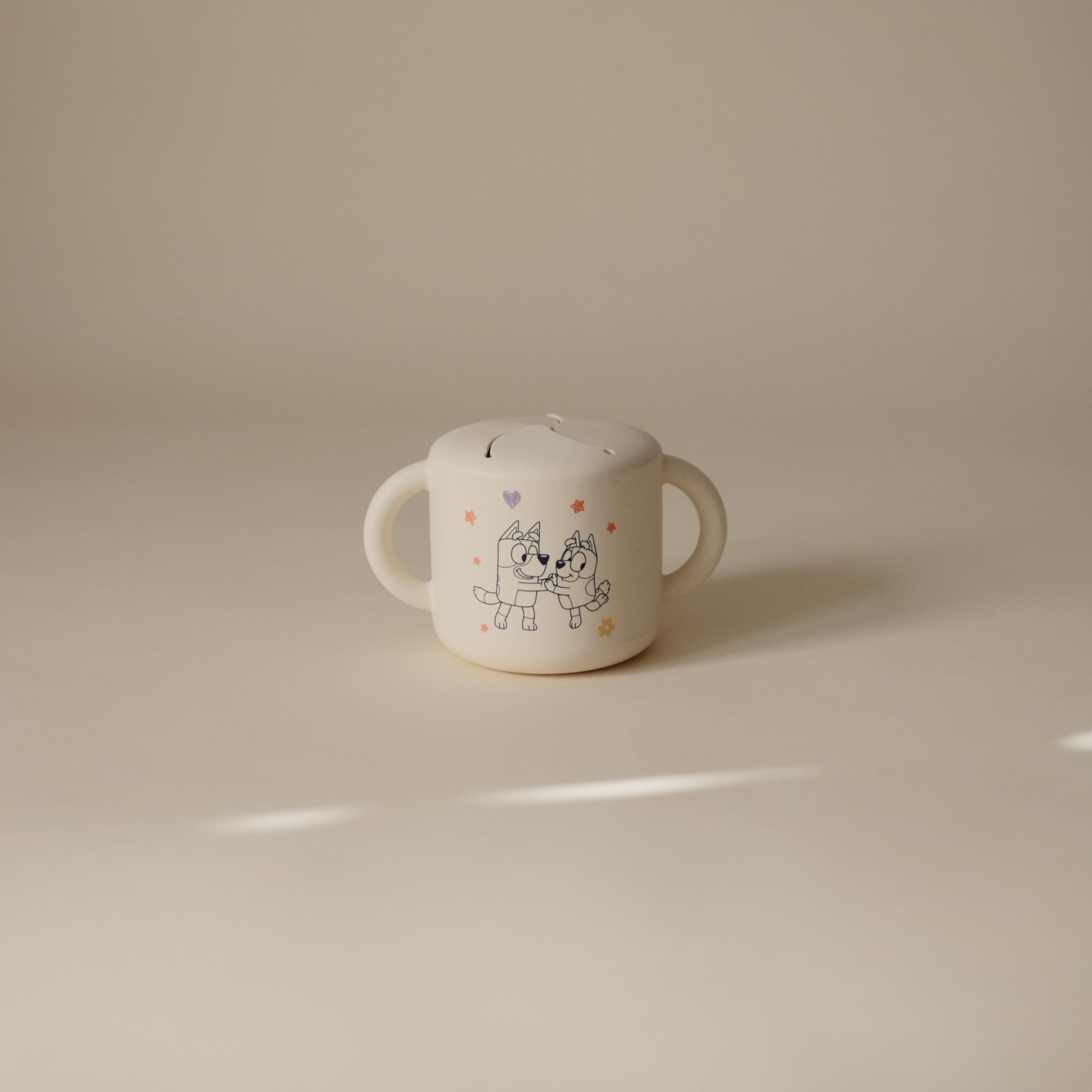 Mushie Bluey silicone snack cup spill-proof design for mess-free on-the-go snacking.