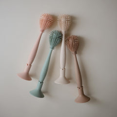 Mushie silicone materials are BPA-free for safe bottle cleaning routines.