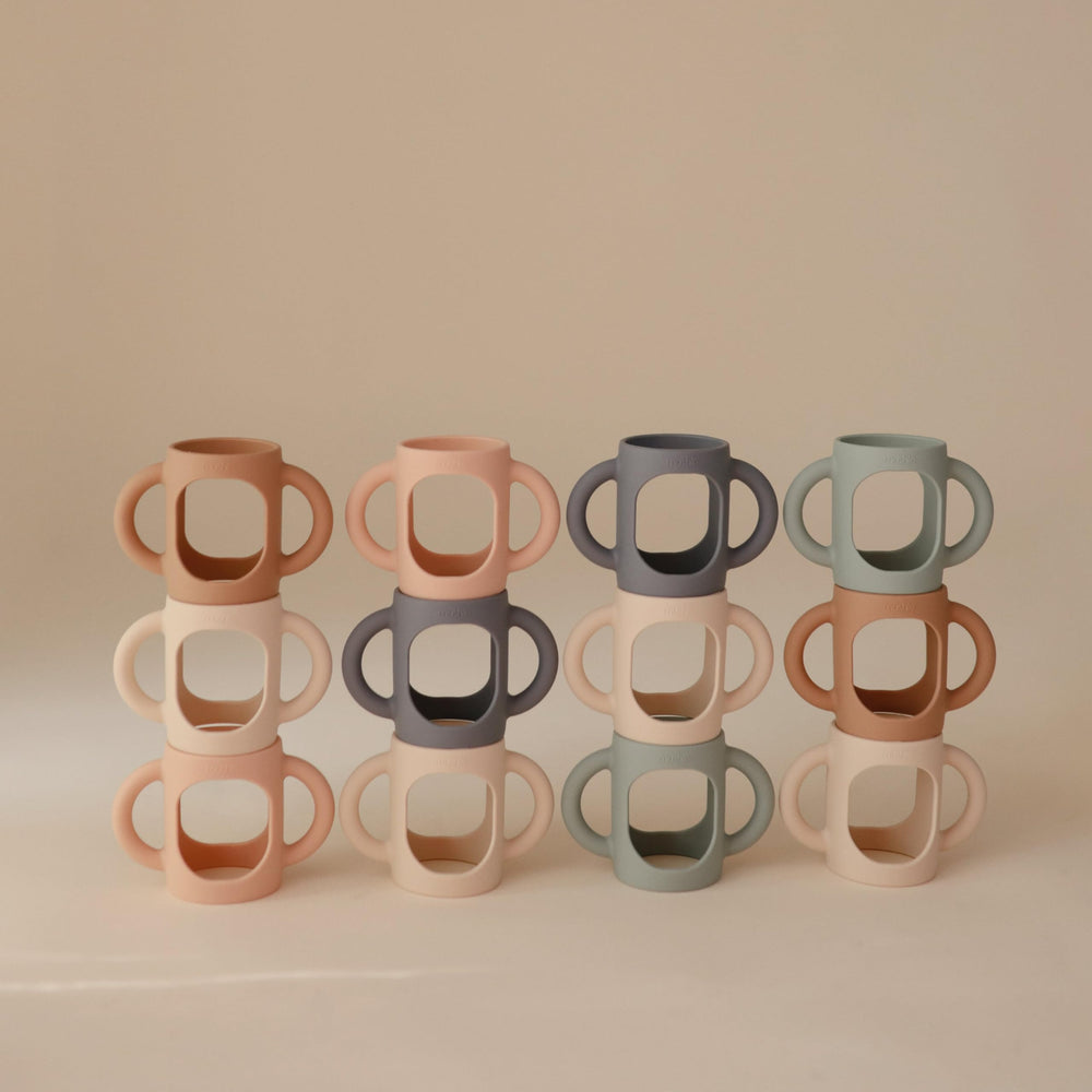Two-pack Mushie bottle handles keeps a spare for busy mornings or travel.