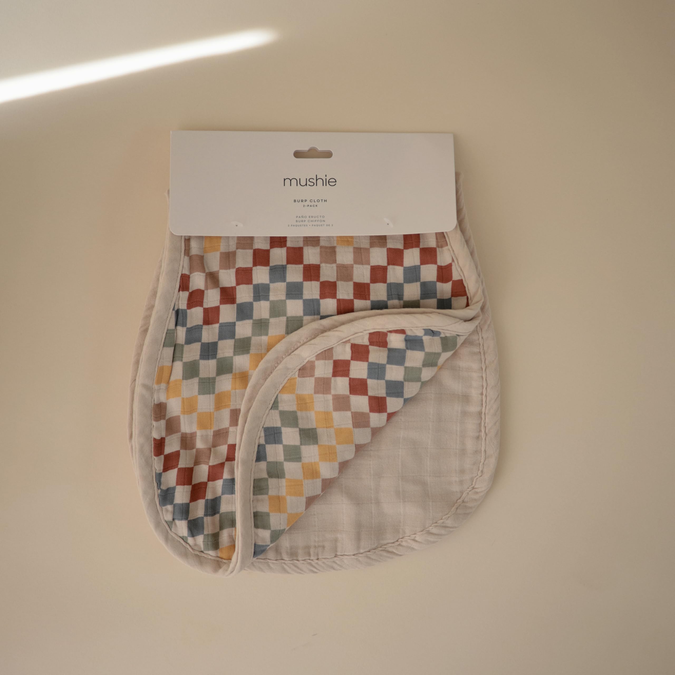 Mushie burp cloth absorbent-muslin keeps spills contained for easy cleanup.