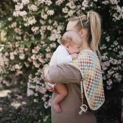 Mushie burp cloth baby-spill-wipe offers versatile use during feeding and play.