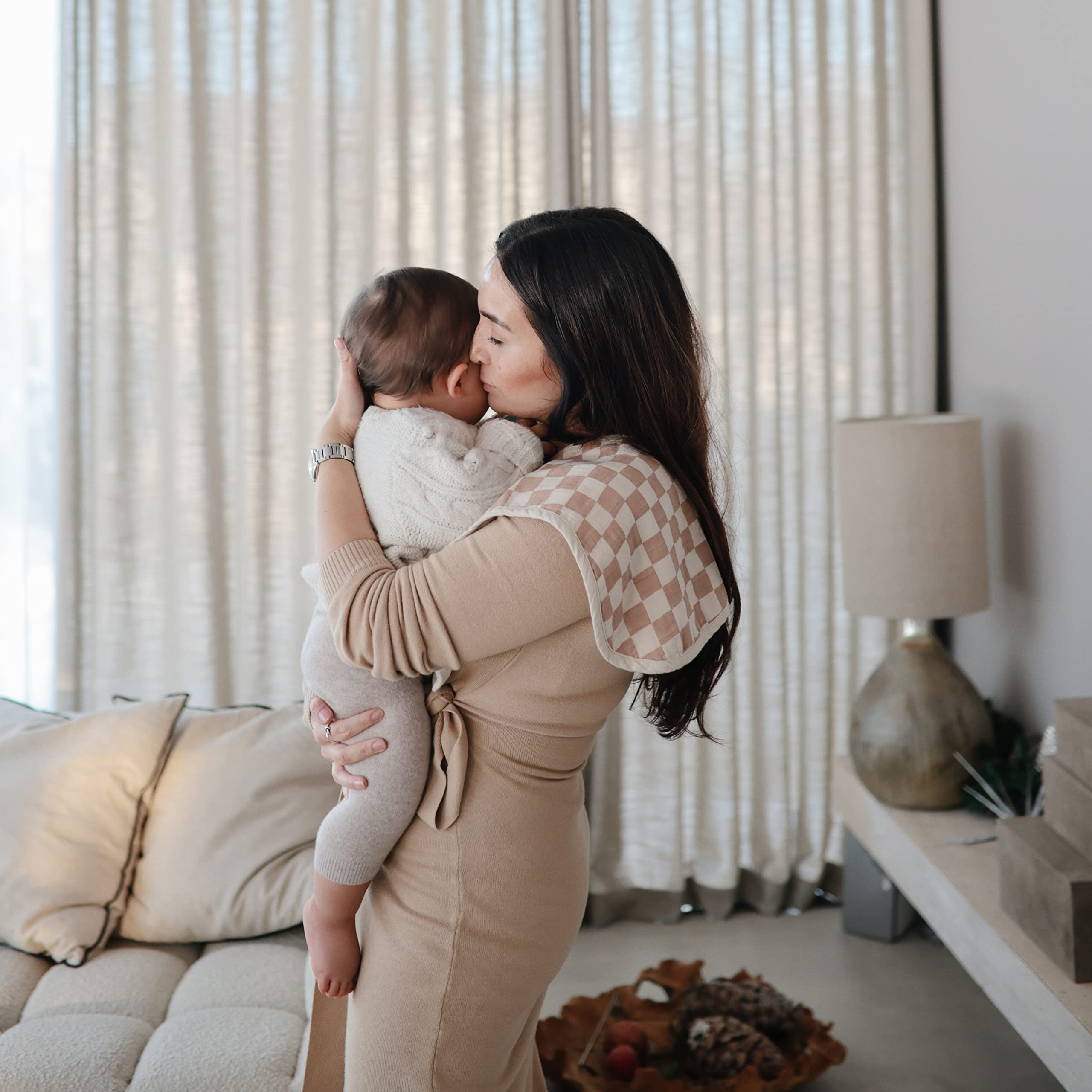 Mushie burp cloth shows machine-washable care for quick cleanups.