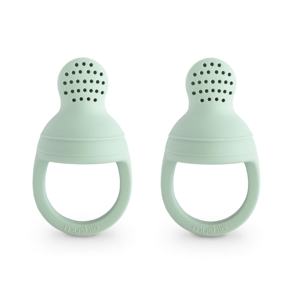 Mushie silicone baby feeder close-up shows soft material for safe, gentle feeding.